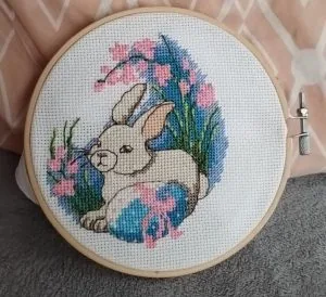 Bunny among spring blossom cross stitch in a hoop, finished by a customer
