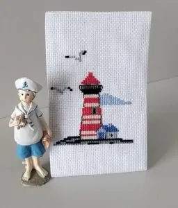 Lighthouse cross stitch finished by a Clover Stitchery customer