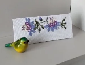 Rose and butterfly border cross stitch finished by a Clover Stitchery customer